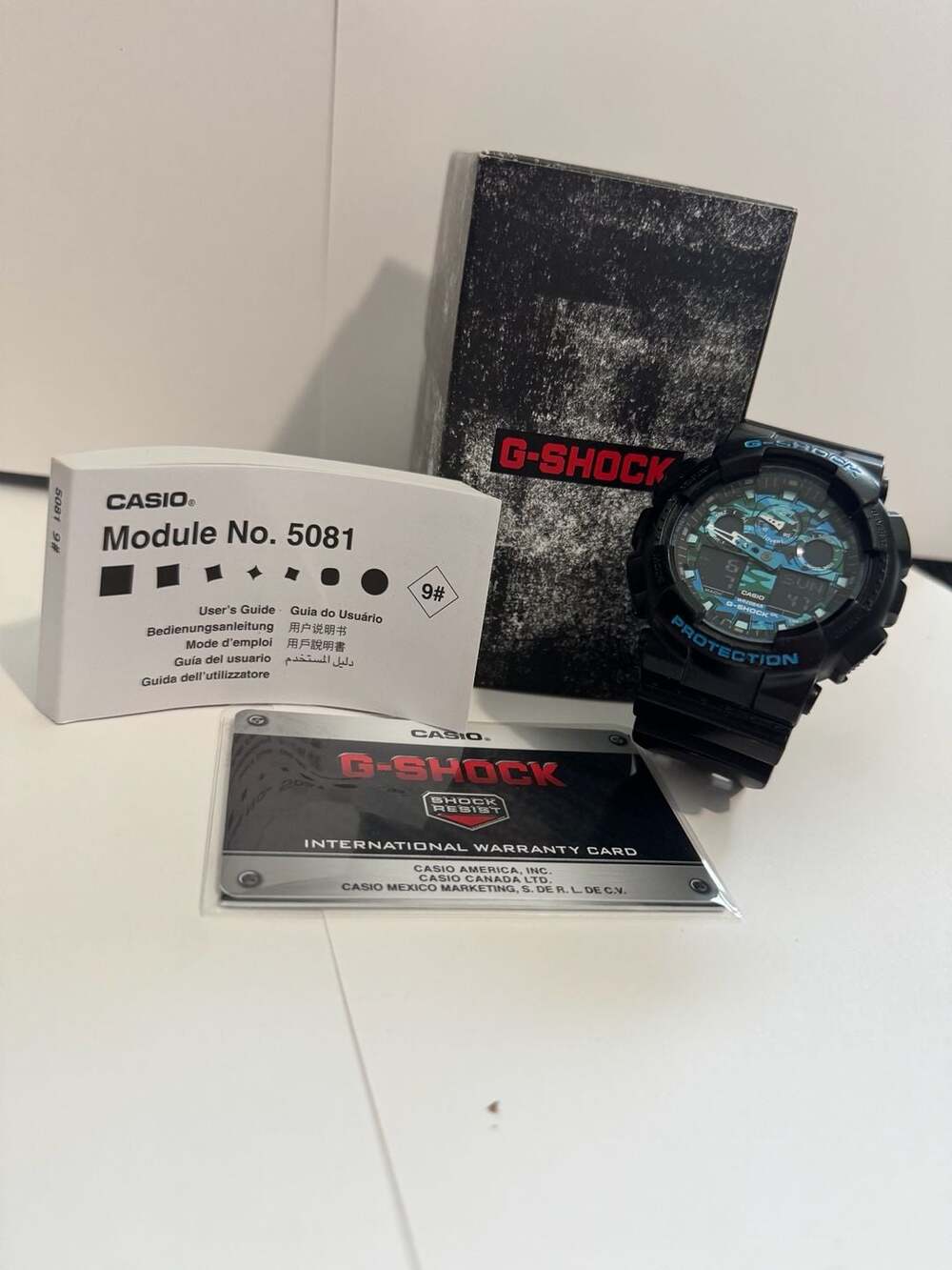 Casio G-Shock GA-100CB-1A Black Blue Camouflage Watch